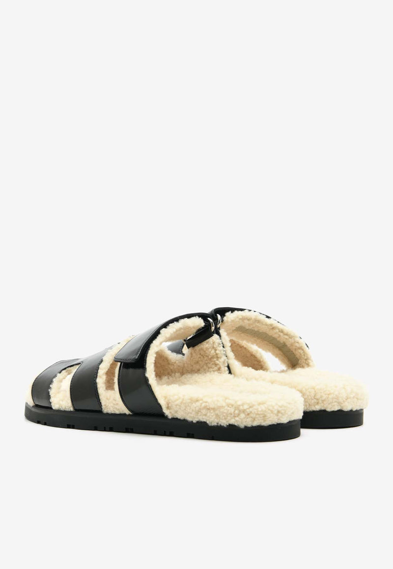 Hermès Chypre Sandals in Black Nappa Glace and Ecru Shearling CSBNGESHER