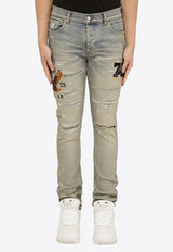 Amiri Logo-Embroidered Skinny Jeans PS24MDS014DE/O_AMIRI-406