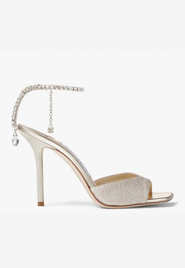 Jimmy Choo Saeda 100 Crystal-Embellished Glitter Sandals SAEDA SANDAL 100 GJV PLATINUM ICE/CRYSTAL