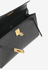 Hermès Kelly Pochette Clutch Bag in Black Ostrich Leather with Gold Hardware