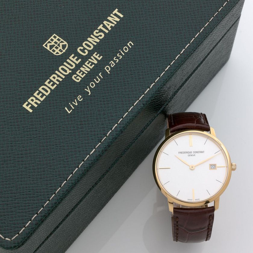 FRÉDÉRIQUE CONSTANT,N° 3063458,Vers 2015,Montre bracelet en acier et métal doré,Boîtier: rond, signé,Cadran: argenté, index baton, date à guichet, signé,Mouvement: quartz,Boucle: ardillon en métal doré, siglée,Diam.: 38 mm,Avec: écrin et surboîte, un livr