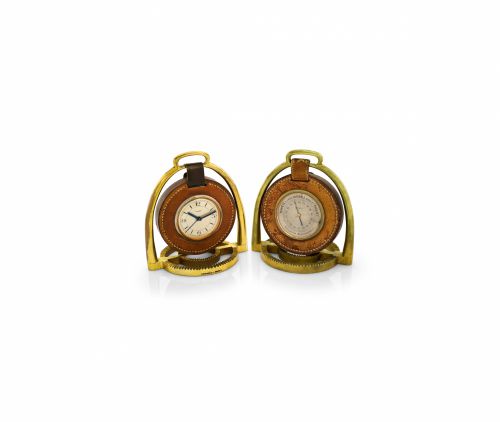 HERMÈS PENDULETTE & BAROMETER ÉTRIER.Hermès, Paris, Etrier, the movement by Pontifa-Audoine.Swiss. Made circa 1935..Fine and rare, 8-day going, gilt brass and leather stirrup-.form desk clock with alarm and a matching aneroid.barometer Holosterique, proba