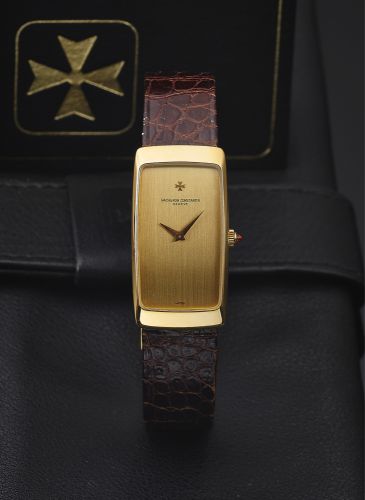 VACHERON & CONSTANTIN REF. 35204 YELLOW GOLD.Vacheron Constantin, Genève, No. 694221, case No. 531541, Ref. 35204. Made in 1982, sold July 7th, 1983..Very fine and elegant, thin, rounded rectangular curved.18K yellow gold wristwatch with an 18K yellow gol