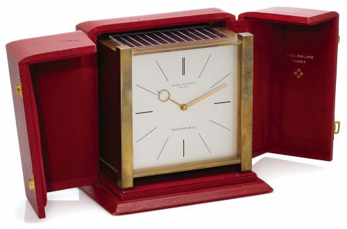 PATEK PHILIPPE SOLAR CLOCK RETAILED BY TIFFANY & CO..Patek Philippe, Genève, Retailed by Tiffany & Co. case No. 1646, Ref. 1675. Made circa 1963..Fine and rare, solar-powered gilt-brass table clock with solar powered electric winding system..Accompanied b