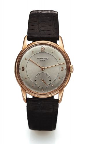 PATEK PHILIPPE REF 1569 PINK GOLD.Patek Philippe, Genève, movement No. 961408, case No..647057, Ref. 1569. Made in 1943..Fine and rare, 18K pink gold wristwatch.