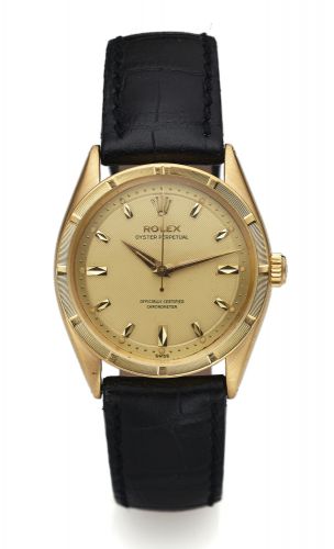 ROLEX REF. 6569 YELLOW GOLD.HONEYCOMB DIAL.Rolex, Oyster Perpetual, Officially Certified Chronometer,.Ref. 6569. Made circa 1960..Fine, center seconds, self-winding, water-resistant.18k yellow gold Chronometer wristwatch.