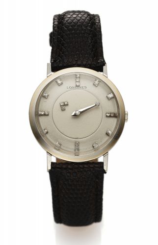 LONGINES REF. 1017 MYSTERY, WHITE GOLD & DIAMONDS.Longines, cased by Longines-Wittnauer Watch Co., New York.Geneva, Montreal, No. 10342079, case No. 553011, Ref. 1017..Made in the 1950s..Fine and unusual, 14K white gold and diamond wristwatch.
