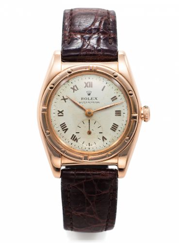 ROLEX REF. 3458 BUBBLE BACK PINK GOLD.Rolex, Oyster Perpetual, Officially Certified Chronometer.Ref. 3458. Made circa 1940s..Fine and rare, tonneau shaped, self-winding, 18K pink gold.Chronometer wristwatch with an 18K yellow gold Rolex.buckle.