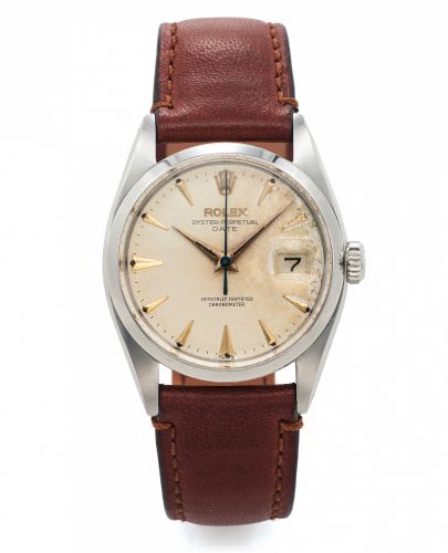 ROLEX REF. 6530 OYSTER PERPETUAL DATE STEEL.Rolex, No. 571331. case No. 90373. Ref. 6530. Made circa 1950s..Fine and rare, center seconds, water-resistant, self-winding.stainless steel wristwatch with date.