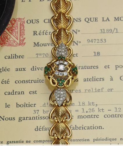 PATEK PHILIPPE REF. 3189.LADY'S.DIAMOND & EMERALD CONCEALED DIAL.Patek Philippe & Co., Genève, No. 947253, case No. 684911.Ref. 3189-1. Made in 1955..Very fine and elegant, 18K yellow gold, diamond and.emerald-set lady's bracelet watch with concealed dial