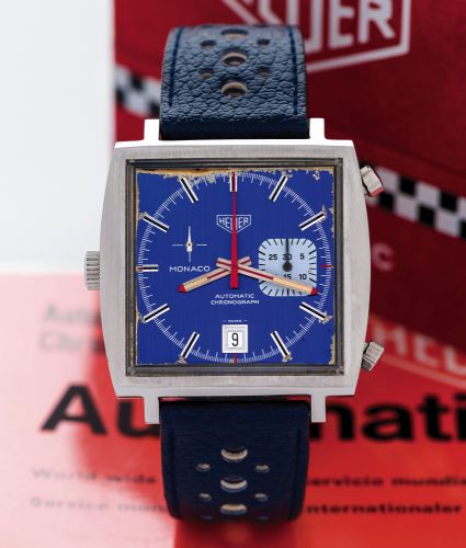 HEUER MONACO REF. 1533 ORIGINAL BOX & GUARANTEE.Heuer, Monaco, Automatic, Chronograph, No. 1911, Ref. 1533B..Sold on January 25, 1978..Fine and unusual, cushion-shaped, self-winding, water resistant.stainless steel wristwatch with round button chronograph