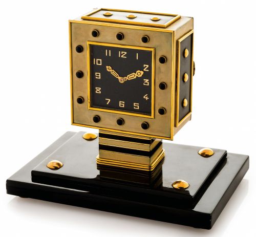 LACLOCHE FRERES - SILVER & GOLD ART DECO CLOCK.Lacloche Frères, No. 874/1034. The case with London import marks for 1929-30..Fine and very rare, Art-Deco, lacquered silver, yellow gold and onyx-set, 8-day going table clock.