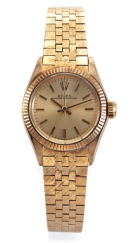 ROLEX, REF. 6619 LADY'S YELLOW GOLD.Rolex, Oyster Perpetual, case No. 2074224, Ref. 6619..Made in 1968..Fine, center seconds, self-winding, water-resistant, 14K.yellow gold lady's wristwatch with a 18K yellow gold.textured Rolex bracelet and deployant cla