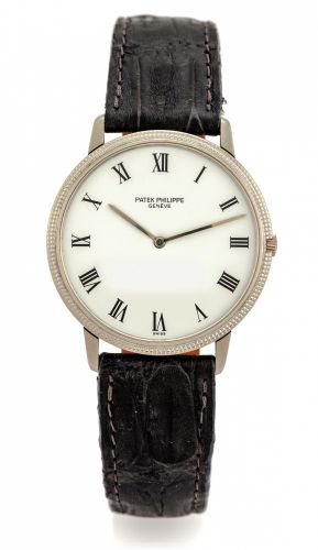 PATEK PHILIPPE REF. 3590.CLOUS DE PARIS WHITE GOLD.Patek Philippe, Genève, No. 1283199, case No. 2730207.Ref. 3590. Made circa 1980..Fine, thin, self-winding, 18K white gold wristwatch..Accompanied by the extract from the Archives