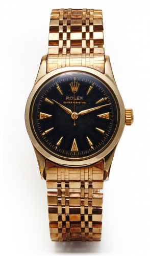 ROLEX REF. 6332 OYSTER PERPETUAL.GOLD PLATED.Rolex, Oyster Perpetual, Ref. 6332. Made in the 1950's..Fine center seconds, self-winding, water-resistant, gold.pated wristwatch with yellow gold rolex bracelet..Dial, case and movement signed.