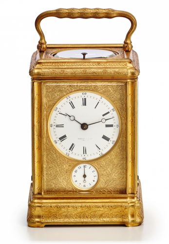DROCOURT GRANDE & PETITE SONNERIE.CARRIAGE CLOCK RETAILED BY TIFFANY.Drocourt, No. 8741, retailed by Tiffany & Co., New York. Made.circa 1890..Very fine, engraved gilt brass, grande and petite sonnerie.striking and repeating, 8 day-going carriage clock wi