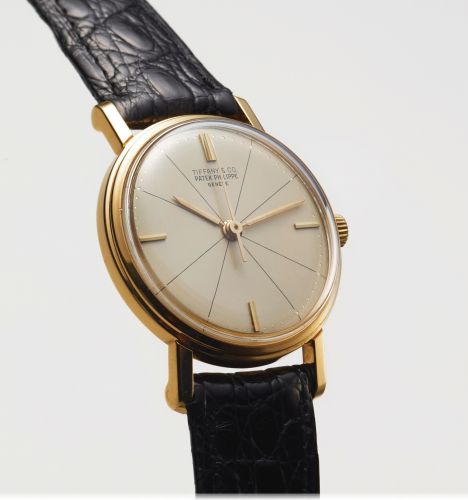 PATEK PHILIPPE REF. 3423 RETAILED BY TIFFANY & CO YELLOW GOLD.Patek Philippe, Genève, No. 707951, case No. 2611125, Ref. 3423, retailed by tiffany. Made circa 1960..Very fine and rare, indirect center-seconds, 18K yellow gold wristwatch. Accompanied by an