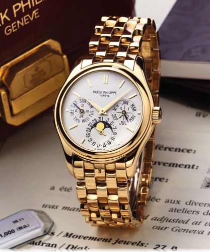 PATEK PHILIPPE REF 5136 YELLOW GOLD.Patek Philippe, Genève, movement No.3126939, case No. 4253531, Ref. 5136/1J. Sold on December 18th, 2010..Very fine and rare, astronomic, self-winding, water-resistant, 18K yellow gold wristwatch with perpetual calendar