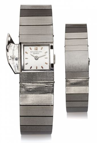 PATEK PHILIPPE REF. 3086 LADY'S.WHITE GOLD CONCEALED DIAL.Patek Philippe & Cie, Genève, No..949422, case No. 2602504, Ref. 3086/14..Made circa 1959. Very fine and unusual.rectangular domed, 18K guilloche.white gold lady's wristwatch with.concealed dial an