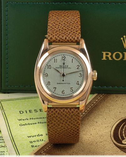 ROLEX REF. 3696 STEEL & PINK GOLD.Rolex, Oyster Perpetual, Chronometer, case No. 300734.Ref. 3696. Made in 1945..Fine and rare, tonneau-shaped, center seconds, self-winding.18K pink gold and stainless steel wristwatch with a gold-plated.Rolex buckle. Acco