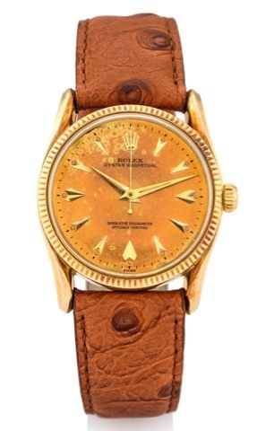ROLEX, REF. 1011.TROPICAL DIAL YELLOW GOLD.Rolex, Oyster Perpetual, Superlative Chronometer.Officially Certified, Case No.601063, Ref. 1011..Made in the 1960's..Fine and rare, center-seconds, self-winding, 14K.yellow gold wristwatch..Dial, case and moveme