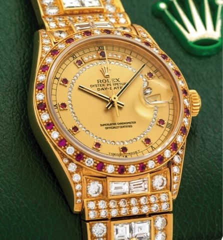 ROLEX REF. 18148 GURU OSHO'S CUSTOMIZED DAY-DATE.DIAMOND & RUBY YELLOW GOLD.Rolex, Oyster Perpetual, Day-Date, Superlative Chronometer Officially Certified, case No. 8652207.Ref. 18148/18000. Made in 1984..Fine and exotic, self-winding, water-resistant, 1