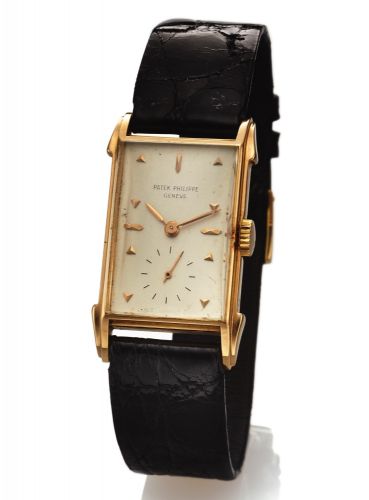PETEK PHILIPPE REF. 2416 PINK GOLD.Patek Philippe & Cie, Genève, No. 973907, case No..512576. Made in 1951..Fine and rare, rectangular, 18K pink gold wristwatch with an 18K pink gold Patek Philippe buckle.