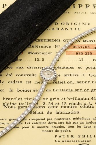 PATEK PHILIPPE REF. 3267/53 DIAMOND BEZEL & BRACELET WHITE GOLD Patek Philippe, Geneve, No. 980220, Ref. 3267/53. Sold in February 1960. Fine and very rare, 18K white gold lady's wristwatch with diamond set bezel and integral bracelet set. Accompanied wit
