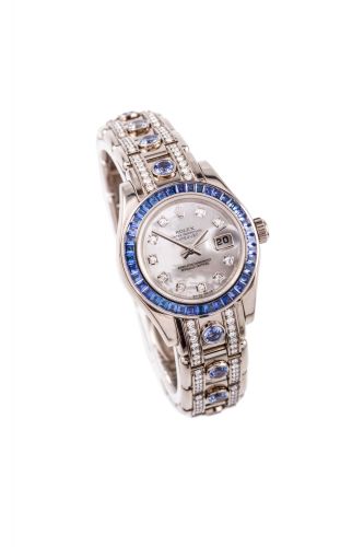 ROLEX, DATEJUST, "OCTOPUS" SAPPHIRES AND DIAMONDS WHITE GOLD Rolex, Oyster Perpetual Datejust, case No. Z 567070, Ref. 80309. Made circa2006. Fine and rare, self-winding, 18k white gold, diamond and sapphire wristwatchwith an 18k white gold, diamond and s