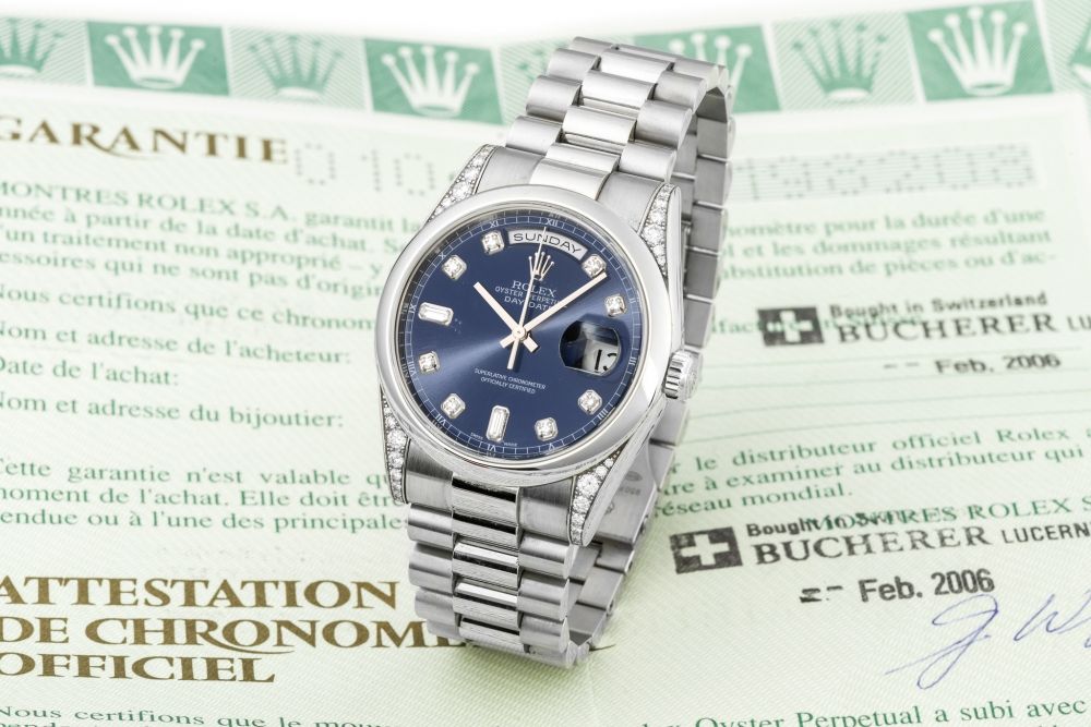 ROLEX, REF. 118296, DAY-DATE, DIAMOND DIAL AND LUGS, PLATINUM A fine, heavy, self-winding, platinum day-date wristwatch with date.