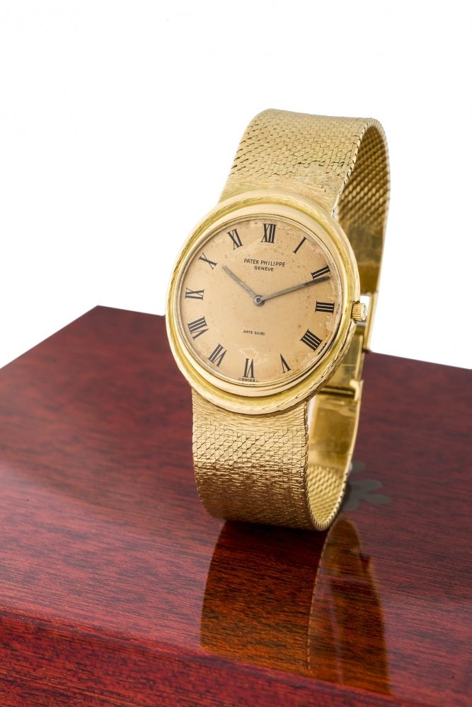 PATEK PHILIPPE, REF. 3594 A fine, self-winding, 18k yellow gold wristwatch.