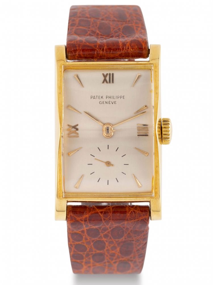 PATEK PHILIPPE REF. 1588 A fine and rare, manual winding, 18k yellow-gold wristwatch. Très belle et rare montre-bracelet mécanique en or jaune 18k deforme rectangulaire.