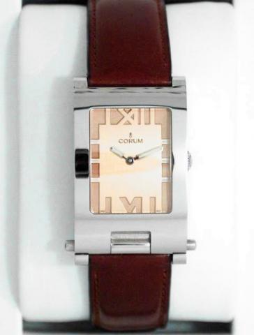 Corum, Tabogan, Ref. 64.151.20. Produced in the 1990's, sold on January 15, 2003..Fine and unusual, water-resistant, asymmetric, rectangular curved, stainless steel quartz gentleman's wristwatch bearing a sliding and hinged mechanism which transforms the 