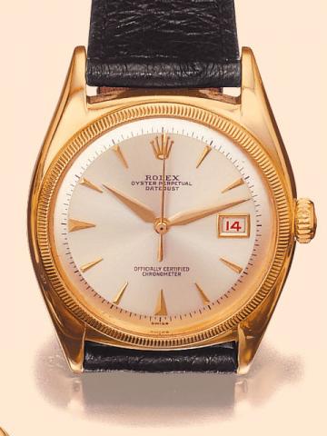 Rolex Oyster Perpetual DateJust, Officially Certified Chronometer, Ref. 6031-6075. Produced in the 1950s. Fine and very rare, tonneau-shaped, center-seconds, self-winding, water-resistant, 10K yellow gold gentleman's wristwatch with date.