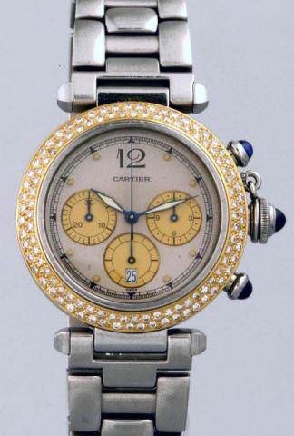 Cartier, Pasha Chronograph, Ref. 1032. Produced in the 1990's.Very fine, water-resistant to 100 m/330 ft, stainless steel, 18K yellow gold and diamonds gentleman's wristwatch with round button chronograph, registers, date and a stainless steel Cartier lin