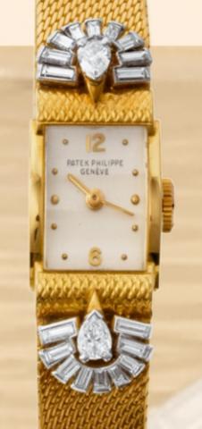 Patek Philippe, Geneve, No. 843717, case No. 686813, Ref. 1189. Made in the 1950s..Very fine and rare, rectangular, 18K yellow gold and diamonds lady's wristwatch with an integrated and linen-textured 18K yellow gold bracelet.