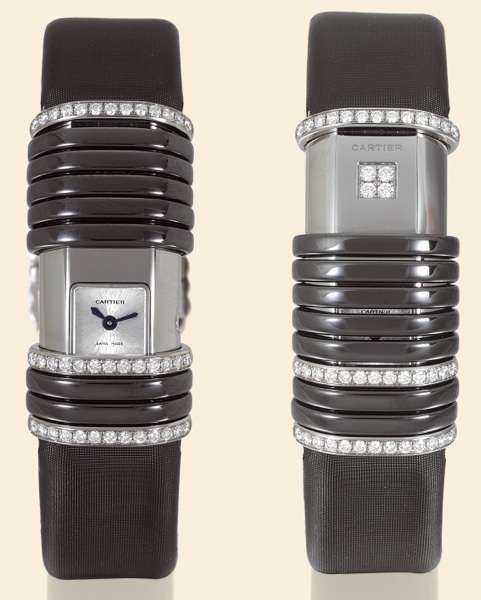 D_claration.Cartier, D_claration, Ref. WT000550. Made circa 2004..Fine and unusual, rectangular-curved, water-resistant, titanium and 18K white gold lady's quartz wristwatch.with diamond, fabric strap and an 18K white gold Cartier deployant clasp. Accompa