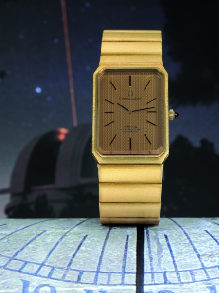 CONSTELLATION EMERAUDE Omega, Constellation, Chronometer, No. 26513578, case No. 8310, Ref. BA.353.0020. Sold on December 12, 1973..Fine and rare, large, rectangular, self-winding gentleman`s wristwatch with raised.topaze-colored faceted crystal and integ