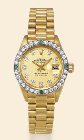 Diamond and Emerald Datejust.Rolex, Oyster Perpetual, Datejust, Superlative.Chronometer, Officially Certified, case No..7202441, Ref. 6907/6900. Made in 1981..Fine center seconds, self-winding, water-resistant, tonneaushaped.18K yellow gold lady