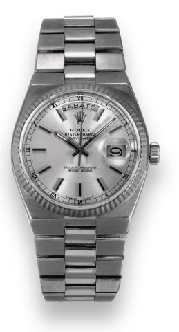 Oyster Quartz - Day-Date.Rolex, Oyster Quartz Day-Date, Superlative.Chronometer Officially Certified, case No. 5808560, Ref..19019. Made in 1978, sold on December 10th, 1979..Fine and rare, center seconds, water-resistant, tonneaushaped.18K white gold qua