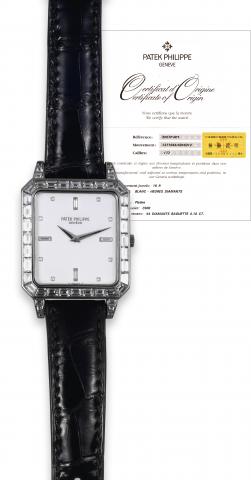 Ref. 5007, Platinum & Diamonds.Patek Philippe, Geneve, movement No. 1371944.case No. 4046312, Ref. 5007P. Sold in August.2002..Extremely fine and rare, water-resistant, rectangular, platinum.and 44 diamond-set (4.10 CT.) wristwatch with a Patek.Philippe p