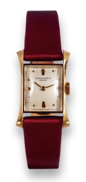 Yellow Gold Ref. 2261.Patek Philippe & Co, Geneve, movement No..943665, case No. 649939, Ref. 2261. Made in 1949, sold on September 21st, 1949..Fine, elegant and rare, rectangular flared, 18K yellow gold lady's.wristwatch with an 18K yellow gold Patek Phi