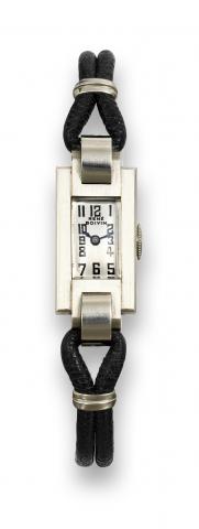 Rene Boivin Art Deco.Rene Boivin, 8731. Made circa 1925..Fine rectangular 18K white gold Art.Deco lady