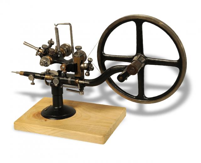 Rounding-Up Tool.Exa, retailed by Sandoz Fils & Co., La.Chaux-de- Fonds & Bienne, Swiss. Made.in the 20th century..Fine, painted steel rounding-up tool on.wooden base..To be sold without reserve