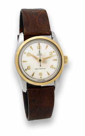 Tudor Steel & Gold Oyster.Tudor, Oyster, Shock-Resisting, case No. 136589, Ref. 7904..Made in the 1950's..Fine and rare, center seconds, water-resistant, stainless steel.and 18K yellow gold wristwatch..To be sold without reserve