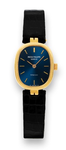 Patek Philippe - For tiffany.Patek Philippe, Geneve, Retailed by Tiffany & Co. No..1404472, case No. 558463, Ref. 4554. Made in 1981, sold on November 18th, 1982..Fine and rare, elegant, oval, 18K yellow gold lady