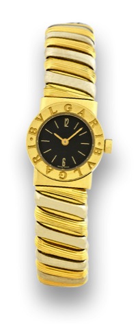 BULGARI _ TWO-TONE _ TUBOGAS.Bulgari, Ref. BB 19 2T. Made in the 1990's..Fine, water-resistant, 18K yellow gold lady's quartz wristwatch with an integrated.18K yellow & white gold Bulgari tubogas bangle bracelet.
