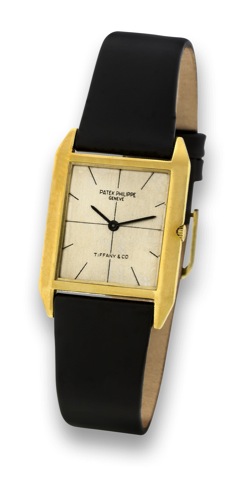 PATEK PHILIPPE _ REF. 3491 _ RETAILED BY.TIFFANY & CO..Patek Philippe, Geneve, movement No. 1131915, case.No. 2648791, Ref. 3491. Made circa 1966..Very fine and rare, rectangular, thin, 18K yellow gold.wristwatch.