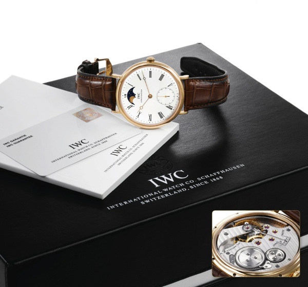 IWC PORTOFINO HAND WOUND OVERSIZED YELLOW GOLD.International Watch & Co., (IWC), Schaffhausen, Portofino Hand-Wound, movement.No. 3031792, case No. 3336800, Ref. IW544803. Sold on April 20th 2010..Very fine, large, 18K yellow gold wristwatch with moon pha
