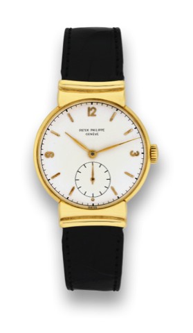 PATEK PHILIPPE, REF.1585.YELLOW GOLD..Patek Philippe, Geneve, movement.No. 966431, case No. 658931, Ref. 1585..Sold on October, 27th 1950..Very fine and rare, 18K yellow gold.wristwatch with an 18K yellow gold.Patek Philippe buckle. Accompanied by.the Ext